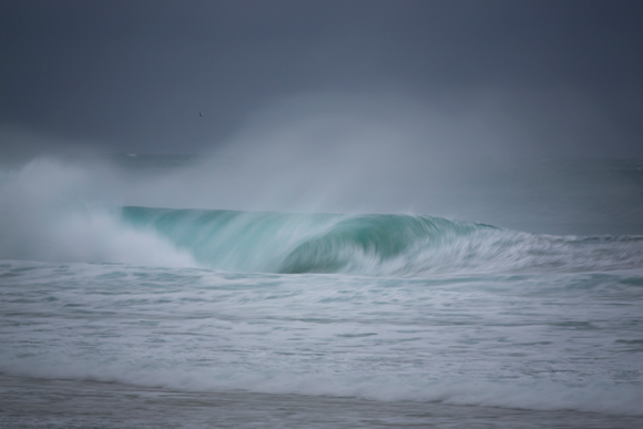 A hollow wave breaks on an east swell at St Kilda Beach