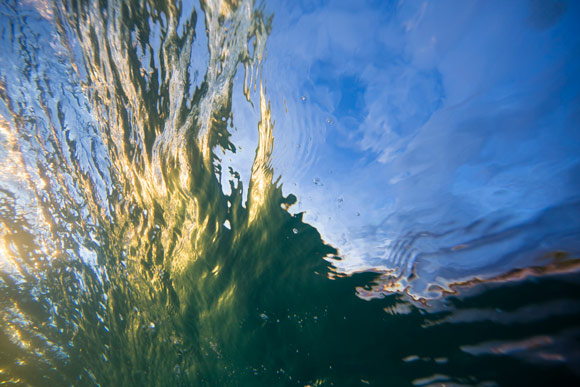 Sunset reflection inside the wave