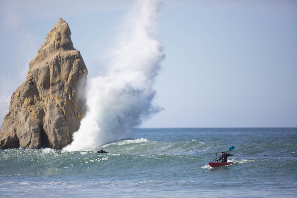 Kayaker running the gauntlet