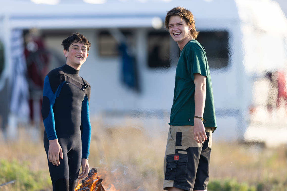 Nuku and Eli gathering around the fire